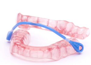 pink somnodent oral appliance with blue band