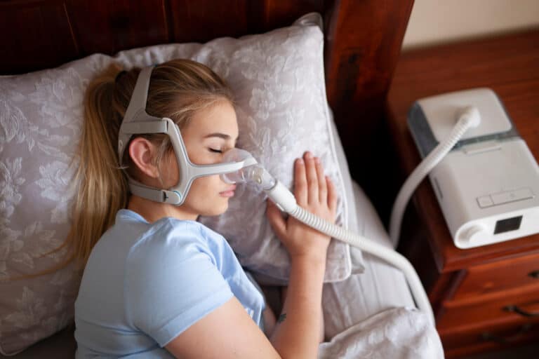 Young,Female,Sleeping,With,Cpap,Machine,For,Sleep,Apnea